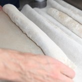 Transferring the baguettes with a flipping board