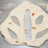 Cutting the fougasse dough