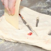 Cutting the fougasse dough