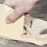 Cutting the fougasse dough