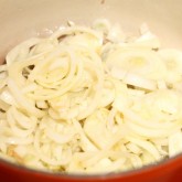 Frying sweet onions for the quiche filling