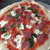 Classic pizza with mozzarella, basil and organic salume - dough has rested in fridge for 24 hours