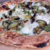 Pizza with grilled aubergines, mozzarella, parmesan and jalapeño pesto