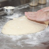 Use a plastic scraper to get underneath the dough