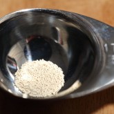 0.1 gram of yeast in a teaspoon