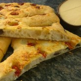 Henrique Cipriano - Our ‘ciabatta-focaccia’ : Our recipe variation 'ciabatta, focaccia'! I added black olives, fresh rosemary and parmesan cheese!