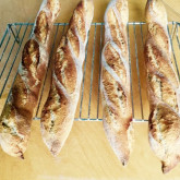 Nick Turner - Ficelles - I've now tried both baguette recipes a few times with varying success, but your Ficelle recipe is one I keep coming back too again and again. The timings work just great for for nice fresh loaves for dinner time, plus the four shaped loaves fit neatly on to the baking stone in my domestic oven. I usually just use 100% bread flour and they turn out vey baguette like with a beautifully crisp crust and light crumb. The batch in the picture however were made using an 100% Organic Stoneground Flour, I upped the hydration a bit too, lovely results which were demolished in minutes by family with cheese and wine!